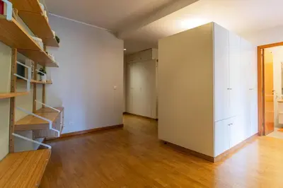 an empty room with a closet and a staircase at Casa da Praça in the center of Porto - GuestSPA in Porto