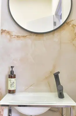a bathroom sink with a mirror on a wall at Oporto Sweet Downtown 5 in Porto