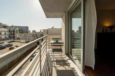 a balcony with a view of a city at Modern Cedofeita by Hosty in Porto