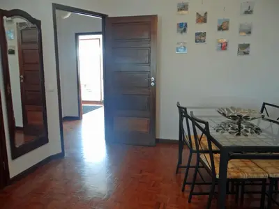 a dining room with a table and a mirror at Alegria Apartment Porto Downtown in Porto