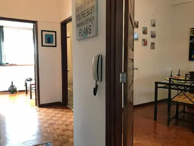 a room with a door with a phone on the wall at Alegria Apartment Porto Downtown in Porto