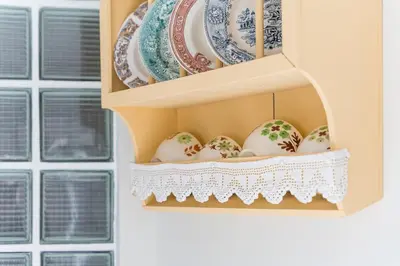 a hutch with plates and easter eggs in it at GuestReady - Porto by Pilar Ridge in Vila Nova de Gaia