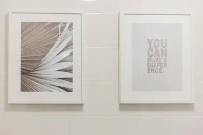 two framed pictures on a white wall at Rooftop Stylish by Hosty in Porto