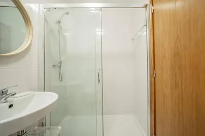 a bathroom with a shower and a sink at Rooftop Stylish by Hosty in Porto