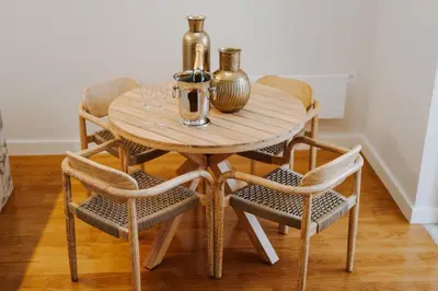 a wooden table with two vases and two chairs at Romantic Luxury House w Captivating Outdoor Patio in Porto