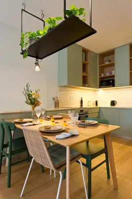 a yellow chair and a table in a room at Ateneu Boutique Townhouse Bolhão in Porto