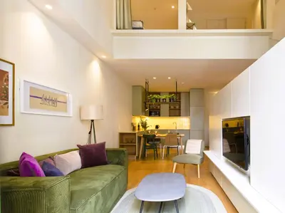 a bedroom with a bed and a window at Ateneu Boutique Townhouse Bolhão in Porto