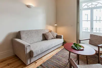 a living room with a couch and a table at bnapartments Loftpuzzle in Porto