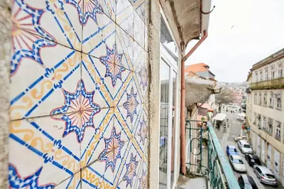 a tiled wall on the side of a building at So Simply Ribeira in Porto