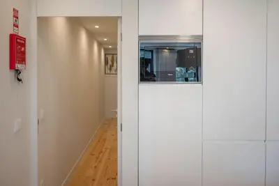 a hallway with a door leading into a room at Truly Porto in Porto