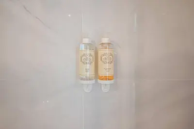 two bottles sitting on a shelf in a wall at Truly Porto in Porto