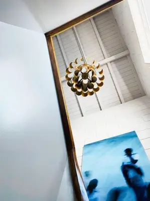 a chandelier hanging from a ceiling in a room at Fabrica No Jardim in Porto