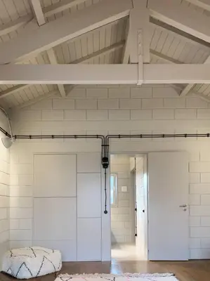 a room with white walls and a white door and a doorway at Fabrica No Jardim in Porto