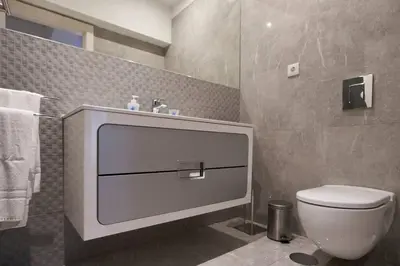 a bathroom with a toilet and a sink at So Family Porto in Porto