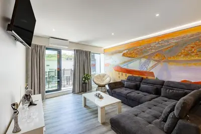 a bedroom with two beds and a window at Porto City Holidays by Douro River in Porto
