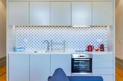 a dishwasher with its door open in a kitchen at Boavista Prime Studio in Porto