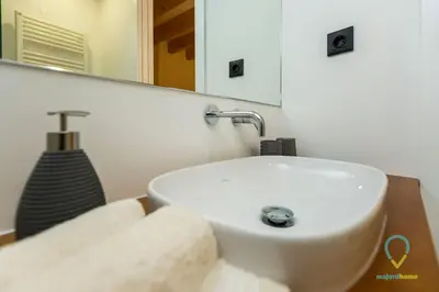 a bathroom with a white sink and a mirror at Trendy Porto in Porto