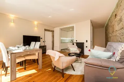a living room with a couch and a table at Trendy Porto in Porto