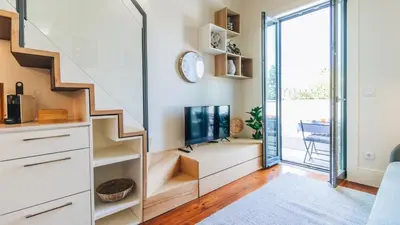 a kitchen and dining room with a table and chairs at Terrace Pool Apartment Oporto by LovelyStay in Porto