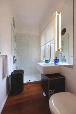 a bathroom with a sink and a tub at Boavista Sunlit Duplex with Terrace in Porto