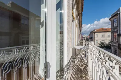 a balcony with a view of a building at GuestReady - Comendador Sto Ildefonso in Porto