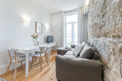 a living room with a couch and a table at GuestReady - Comendador Sto Ildefonso in Porto