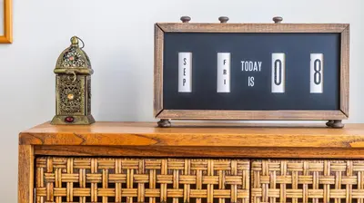 an old clock sitting on top of a table at Boavista Loft by LovelyStay in Porto