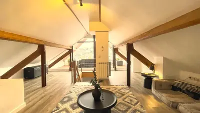 a living room with a couch and a table at RIBEIRA by YoursPorto in Porto