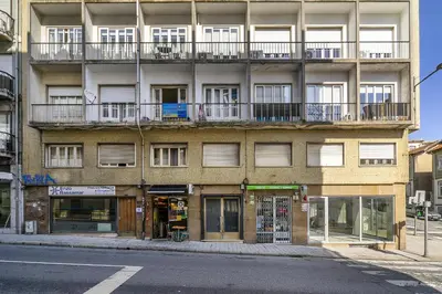 an apartment building with a balcony on the side of the street at WHome SC996 in Top Location 3-Bed Perfect to explore Porto in Porto