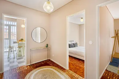 a bedroom with a bed and a mirror at WHome SC996 in Top Location 3-Bed Perfect to explore Porto in Porto