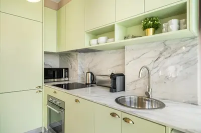 a kitchen with a sink and a microwave at WHome SC996 in Top Location 3-Bed Perfect to explore Porto in Porto