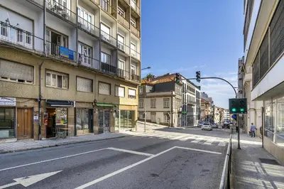 an empty city street with a green traffic light at WHome SC996 in Top Location 3-Bed Perfect to explore Porto in Porto