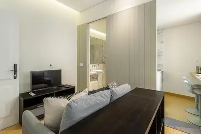 a living room with a couch and a table at WHome Timeless Luxury Porto w/ AC & Elevator in Porto