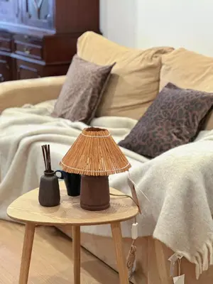 a table with a lamp on it next to a bed at Downtown 2 minutes by walk to center and metro-direct to airpot T4 in Porto