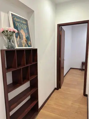 a hallway with a book shelf and a door at Downtown 2 minutes by walk to center and metro-direct to airpot T4 in Porto