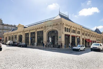 a building on a street with cars parked in front of it at Downtown 2 minutes by walk to center and metro-direct to airpot T4 in Porto