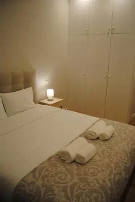 a bedroom with a bed with two towels on it at Gaia Loves You - Serra do Pilar in Vila Nova de Gaia