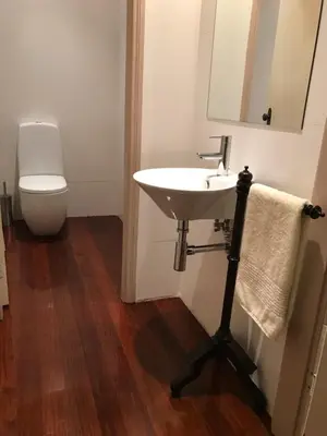 a bathroom with a sink and a toilet at Maison des Amis Porto in Porto