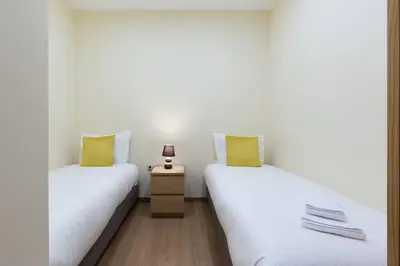 two beds sitting next to each other in a room at OPO Santa Catarina in Porto