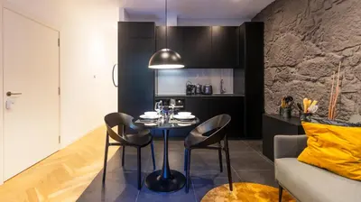 a kitchen with a table and chairs in a room at Luxury Oasis in Bonfim by LovelyStay in Porto