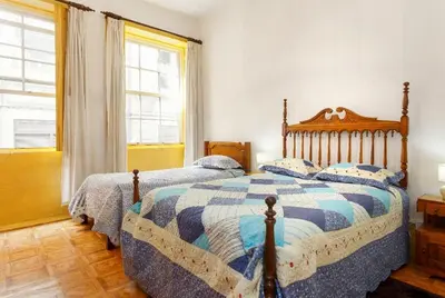 a bedroom with two beds and a window at Porto Chique AL 2 in Porto