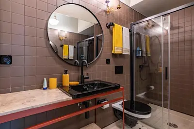 a bathroom with a sink and a mirror at Victoria House in Porto