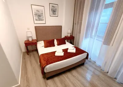 a bedroom with a bed with two tables and a window at River Fleat 0 - Heart of Porto in Porto