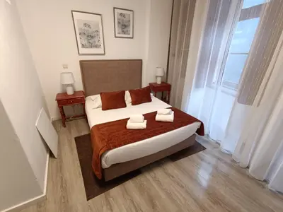 a bedroom with a bed with two towels on it at River Fleat 0 - Heart of Porto in Porto
