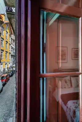 a view from a window of a bed and a street at River Fleat 0 - Heart of Porto in Porto