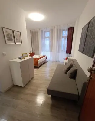 a living room with a couch and a bed at River Fleat 0 - Heart of Porto in Porto