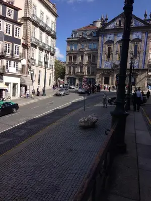 a city street with buildings and a lamp post at Porto Chique AL 3 in Porto