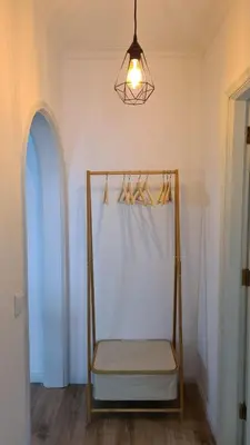 a room with a chair with a curtain and a light at Enjoy Porto's Vibes in Porto