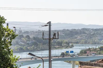 a view of a bridge and a river at Cozy Studio-Fast Wi-Fi-Near Campanhã Station & River in Porto