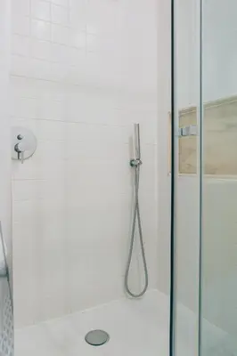 a bathroom with a shower with a glass door at ORM Padrão Apartment in Porto